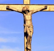 Picture of Jesus on a Cross with a blue sky background